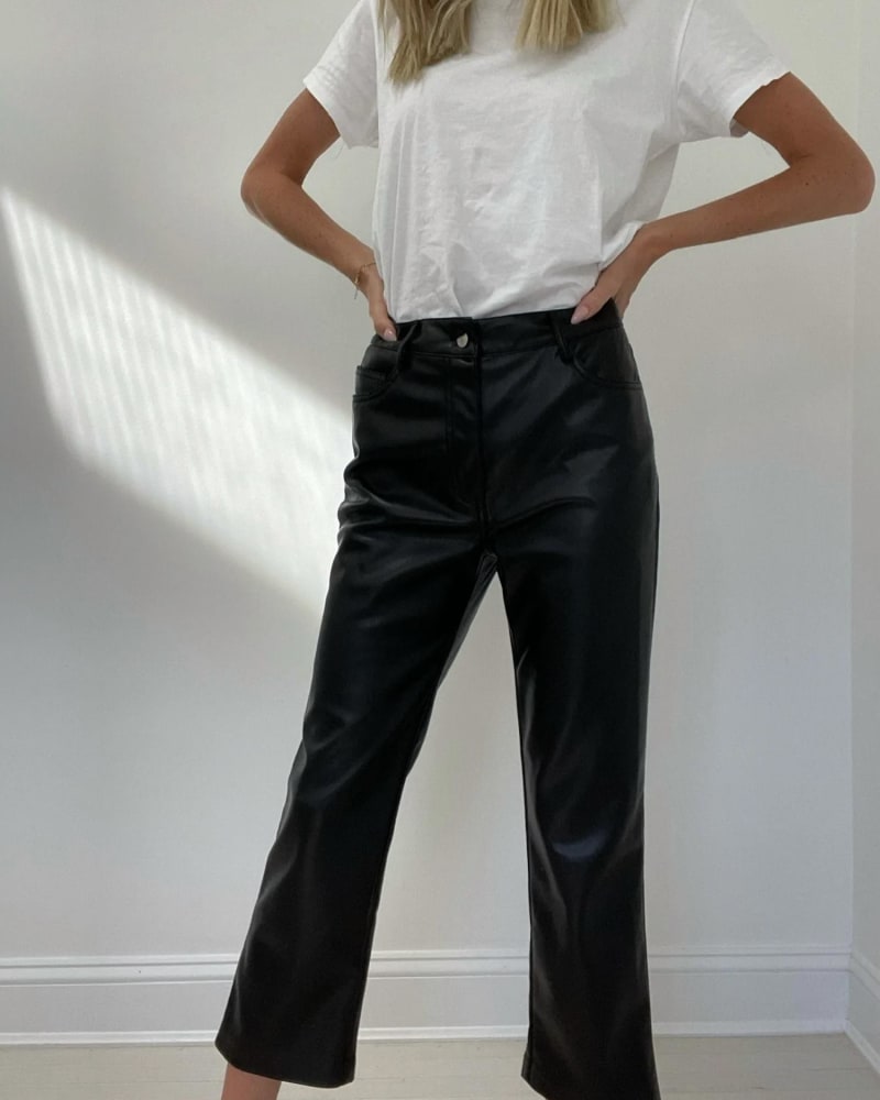 Front of a model wearing a size L Rachel Faux Leather Straight Crop Pant in Black in Black by SIX/FIFTY. | dia_product_style_image_id:343207